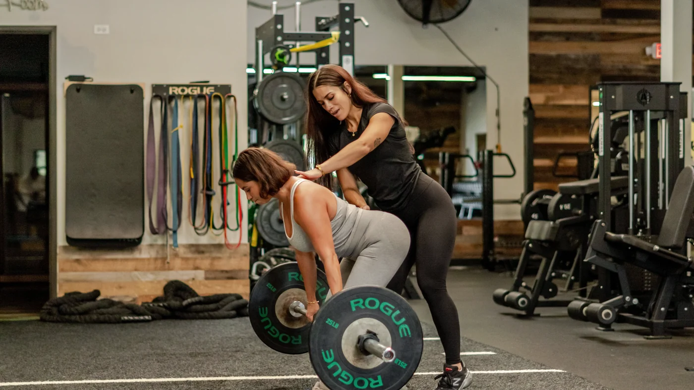 Kayla coaching a client